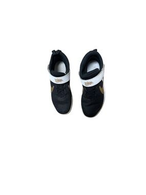 Nike Kids Black Sneakers with White Strap and Gold Swoosh